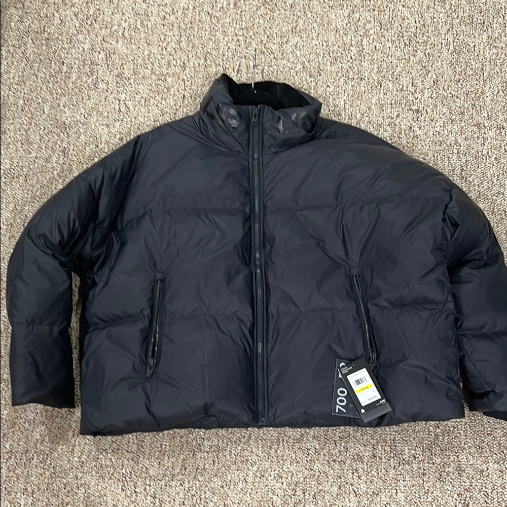 Black Puffer Jacket with High Collar and Quilted Design UNDER ARMOUR